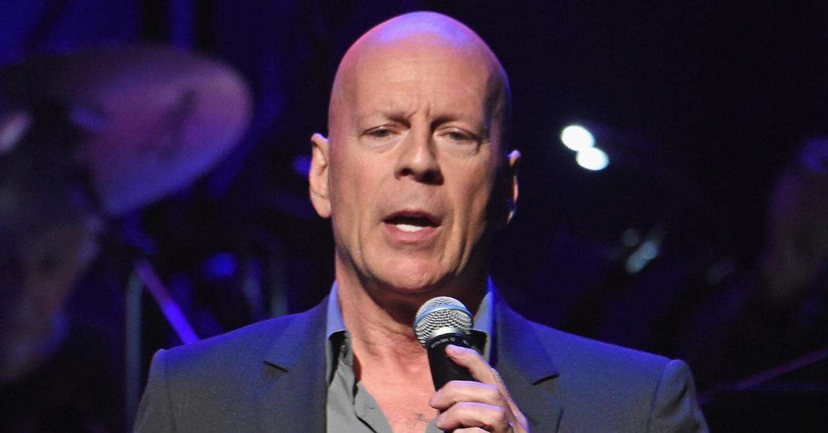 Bruce Willis sings onstage.