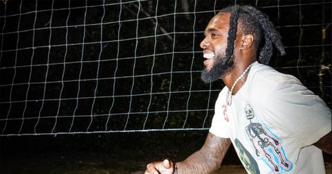 Diontae Johnson mid-stride in front of a net.