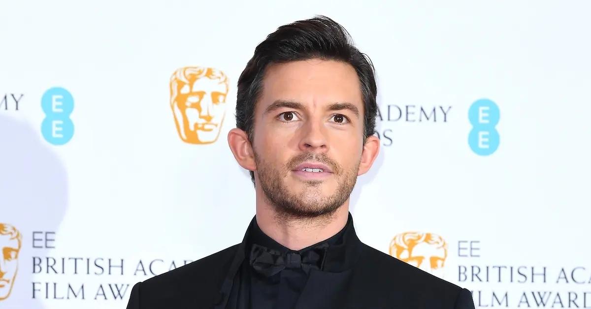 Jonathan Bailey wearing a black suit.