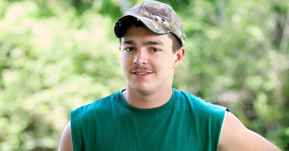 Shain Gandee from 'Buckwild' wearing a green sleeveless shirt