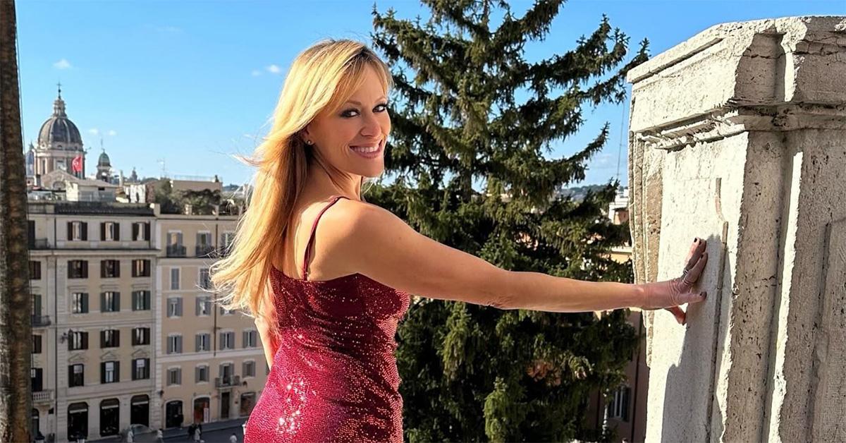 Lilian Garcia in a red dress in Italy. 