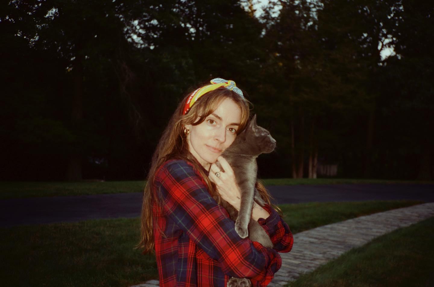 Anna Marie Tendler hugging a cat 