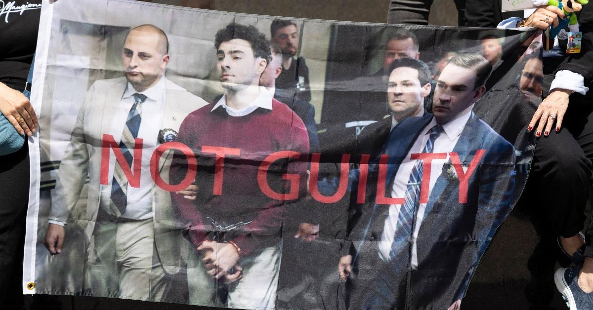 A banner saying Luigi Mangione is not guilty