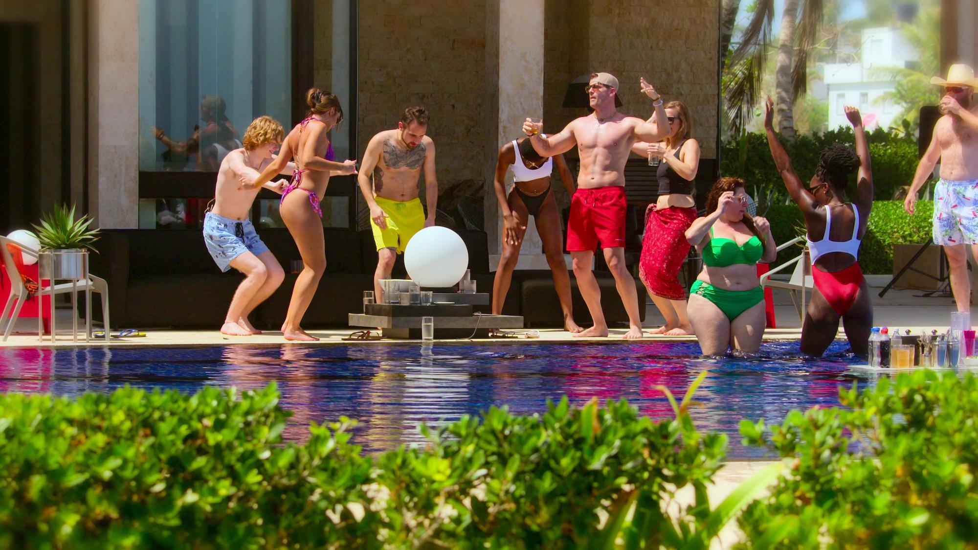 'The Trust' Season 1 contestants Bryce Lee, Julie Theis, Gaspare Randazzo, Tolú Ekundare, Jacob Chocolous, Lindsey Anderson, Simone Stewart, Winnie Ilesso, and Brian Firebaugh are seen hanging by the pool.