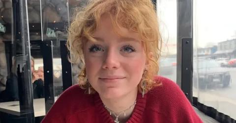 Mamie Laverock candid smile in red shirt