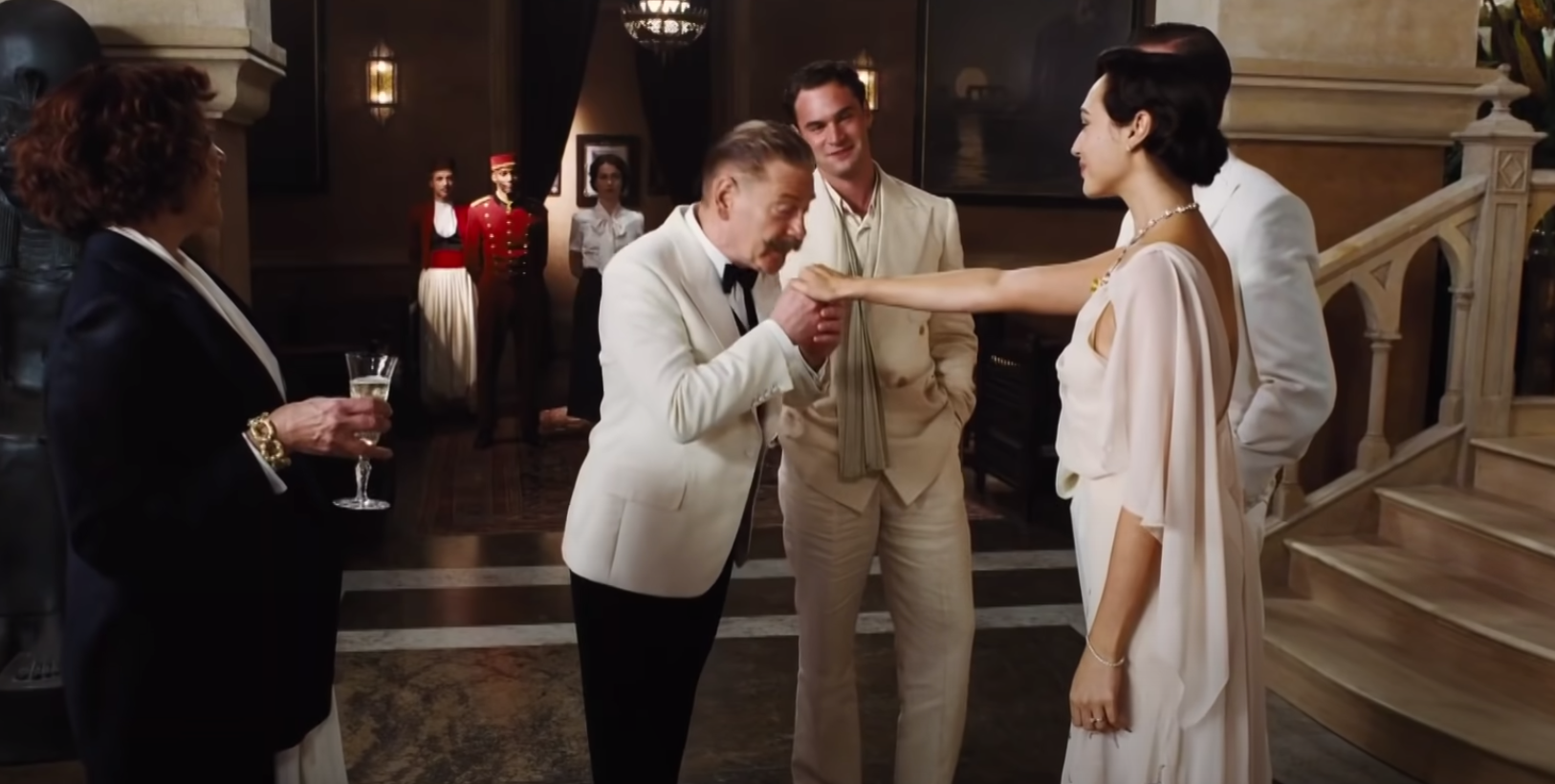 Kenneth Branagh kisses Gal Gadot's hand in 'Death on the Nile'