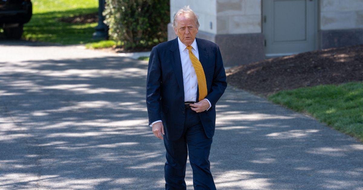 Donald Trump walking out of the White House.