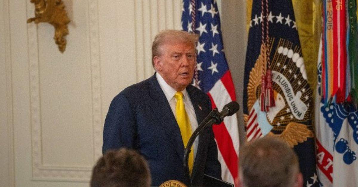 Donald Trump walking up to a podium in the White House. 