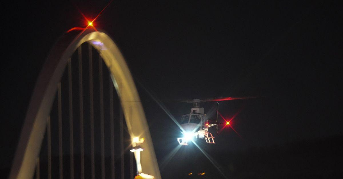 A helicopter searching the Potomac after the Washington, D.C. crash. 