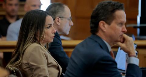 Karen Read sits next to her attorneys at her trial