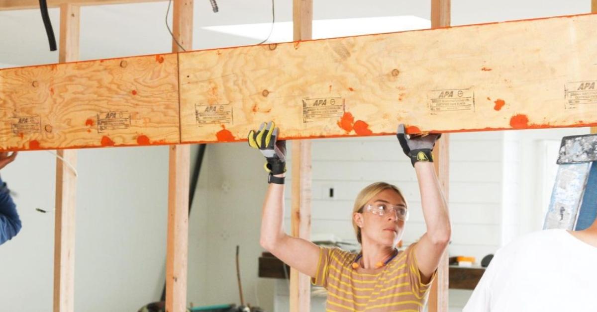 Jasmine Roth doing construction on a house