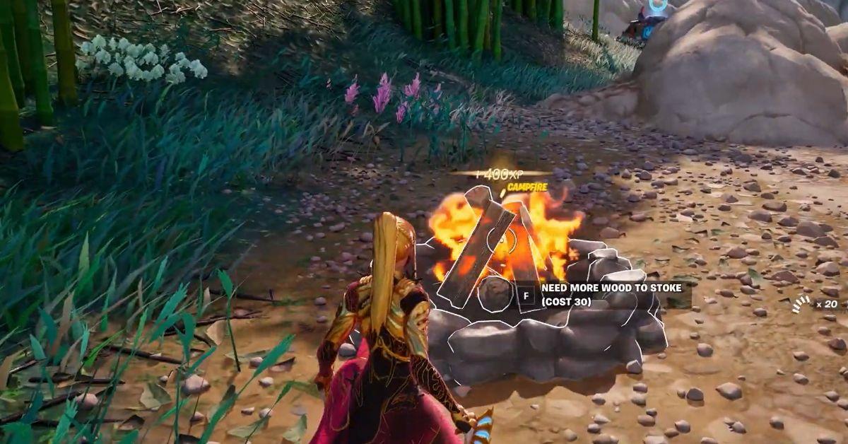 A Fortnite player lighting a campfire.