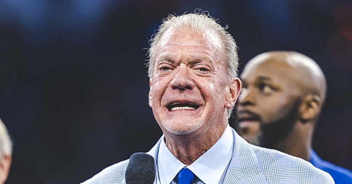 Jim Irsay speaking into a microphone. 