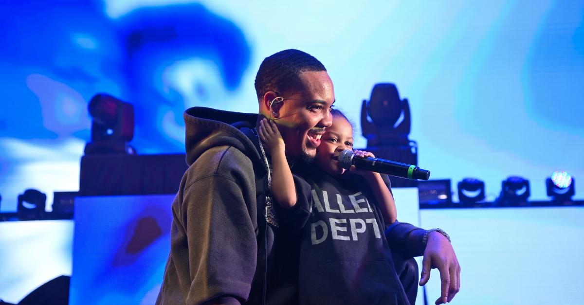 G Herbo and Yosohn on stage wearing black hoodie an t-shirt.