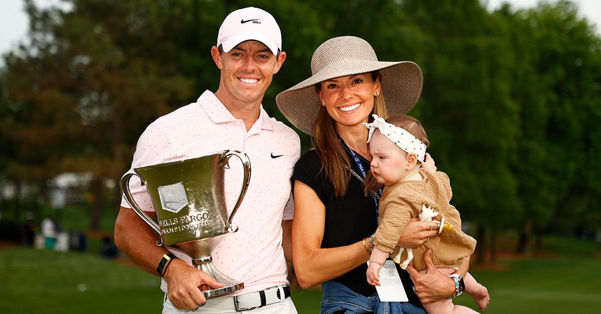 Rory McIlroy, Erica Stoll and their daughter at the Wells Fargo Championship. 