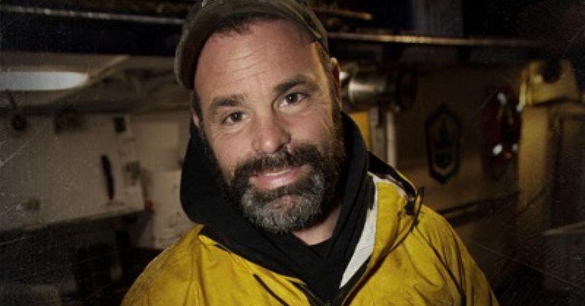 Matt Bradley smiles and poses for a 'Deadliest Catch' promo photo