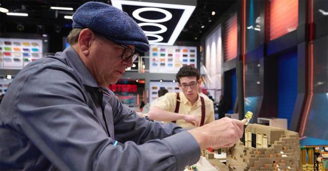 Ben and Poppy building with LEGOs.