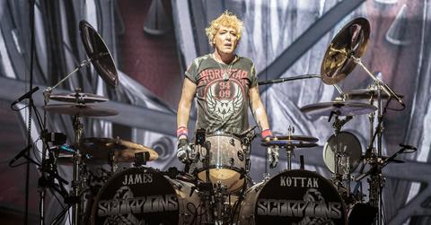 James Kottak standing over his drumset at a Scorpions show.