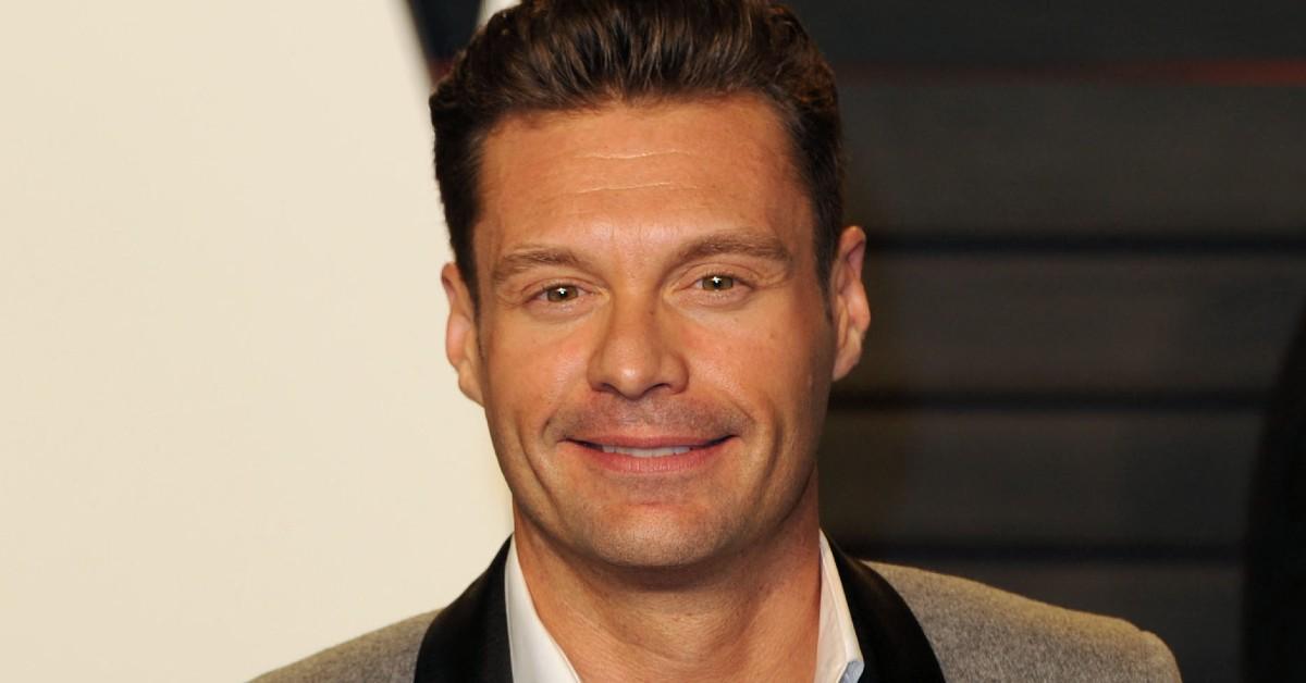 Ryan Seacrest posing for a photo