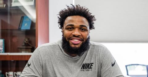 Christian Wilkins sitting behind a desk.