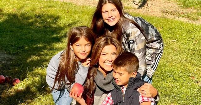 Rachel Campos-Duffy sitting outside with her kids.
