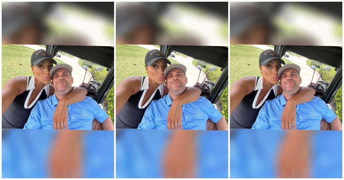 (l-r): A woman and the man she's dating posing together in a golf cart