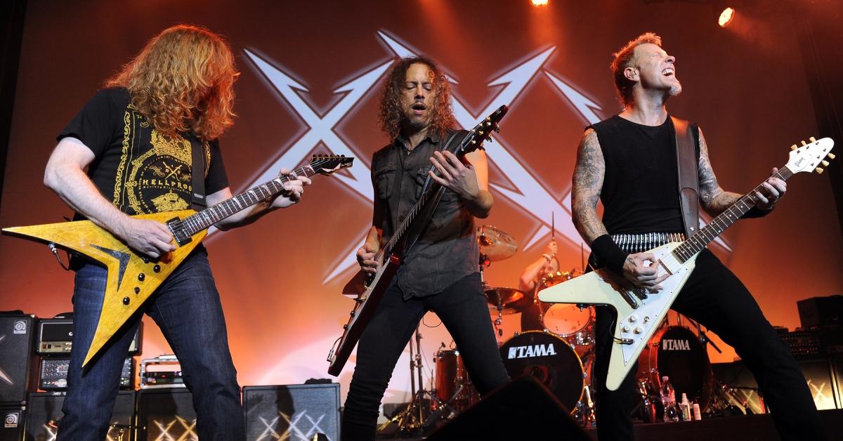 Dave Mustaine, Kirk Hammett, and James Hetfield performing in 2011