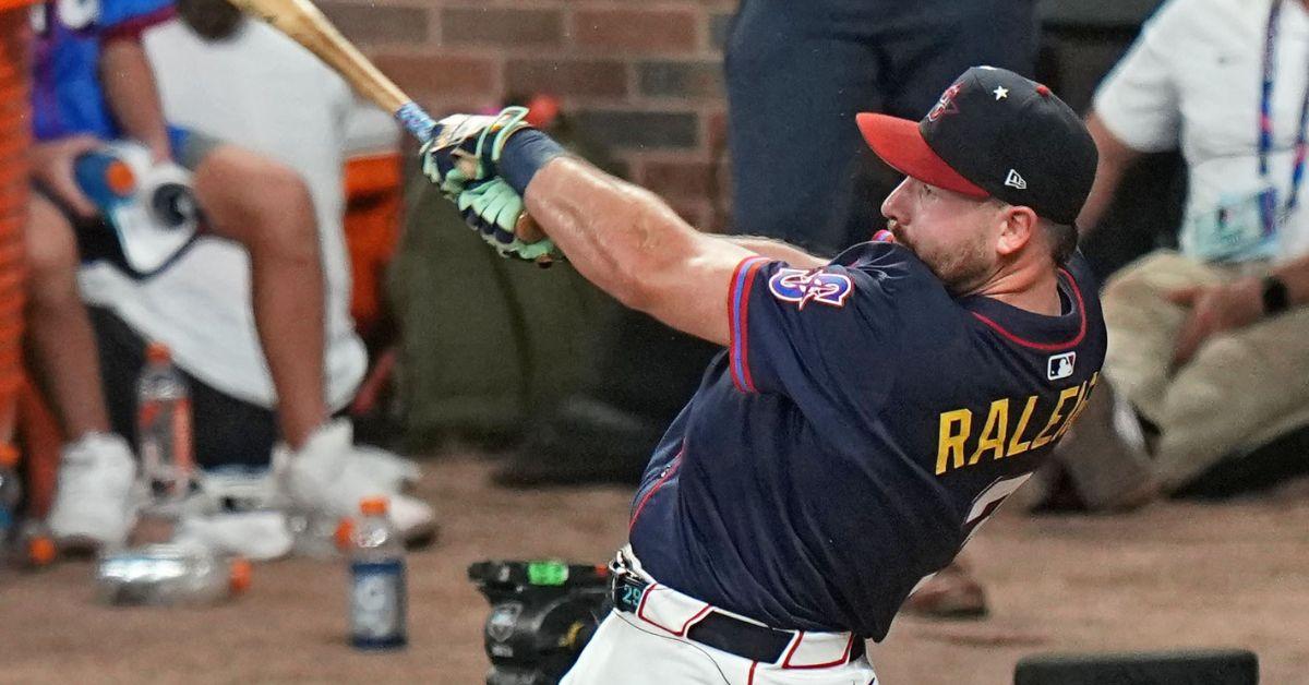 Cal Raleigh swinging a bat in a 2023 game.