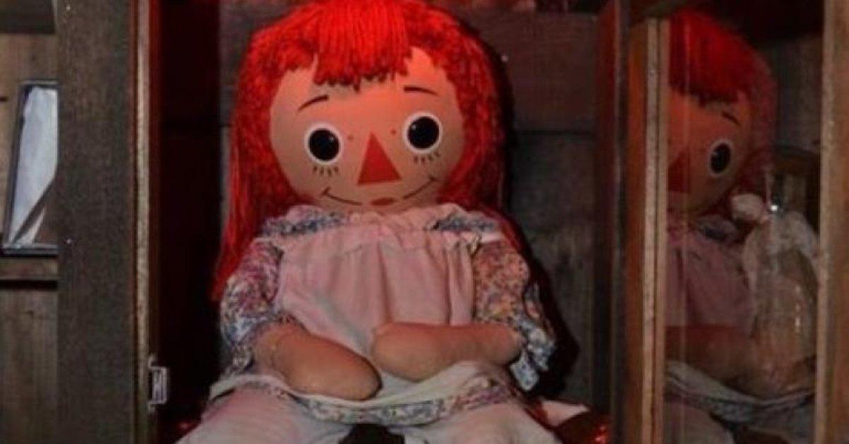 Annabelle doll sitting in her locked case.