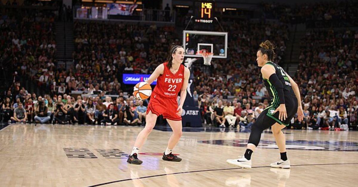 Caitlin Clark handling the ball during a WNBA game.