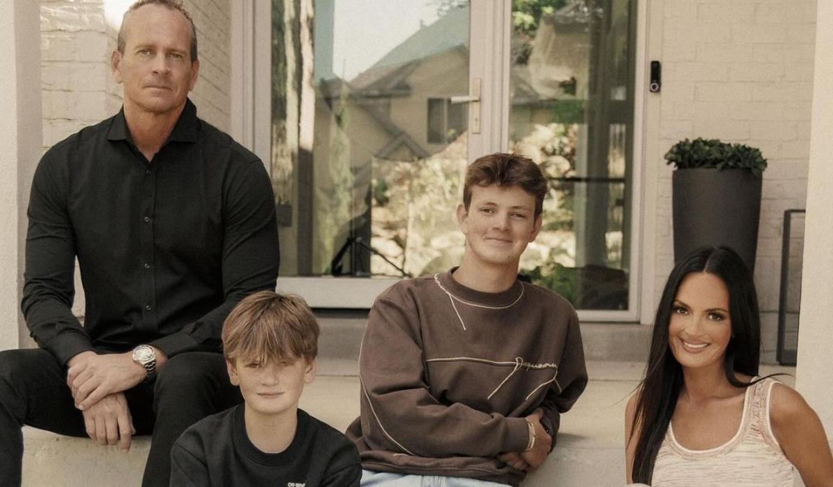 Lisa Barlow with her husband and kids outside of their home