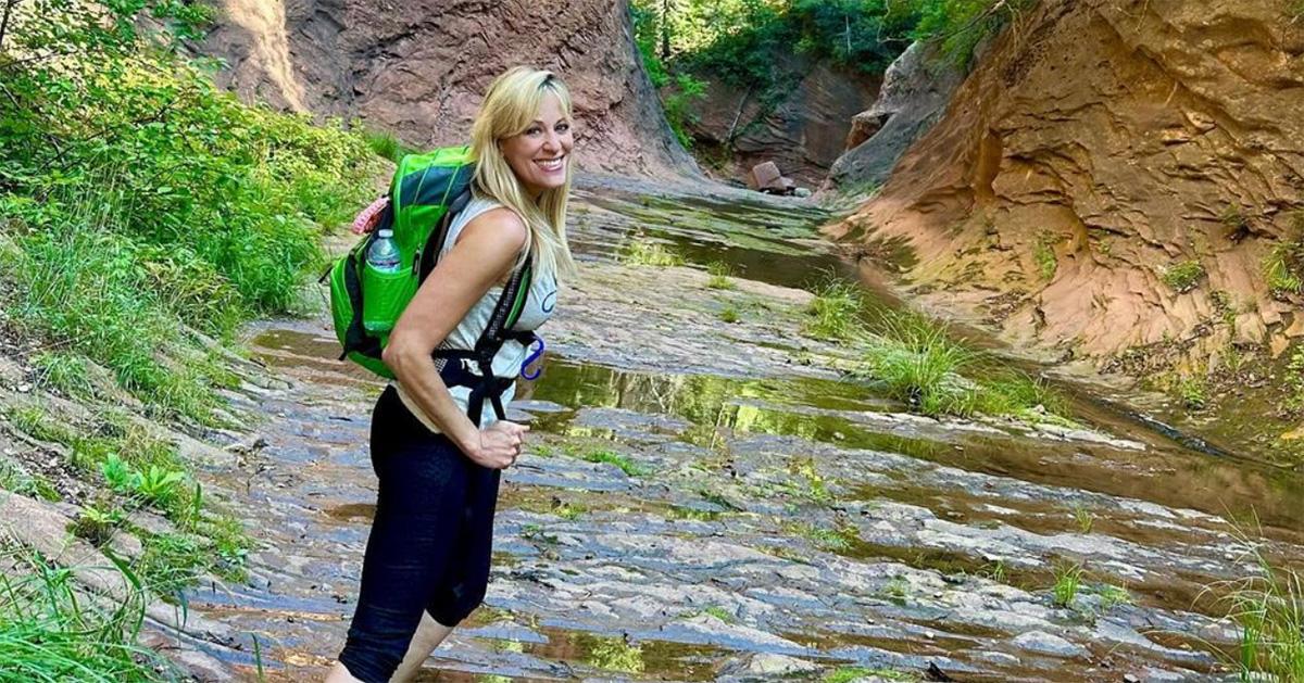 Lilian Garcia hiking with a backpack on. 