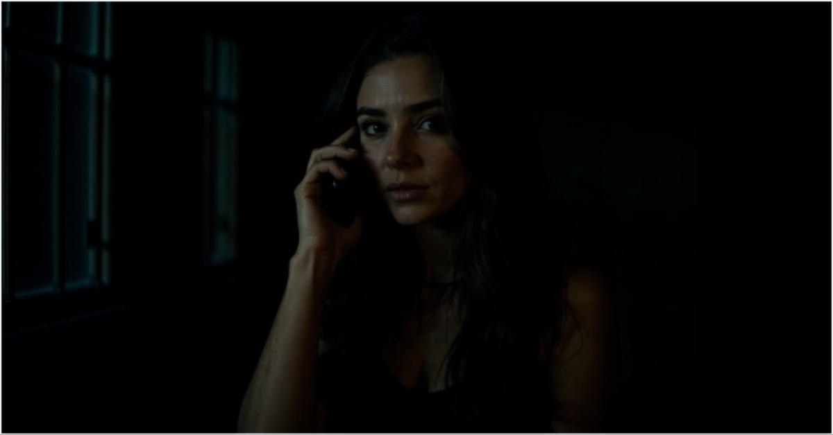 Tilly Norwood talking on a phone in a still
