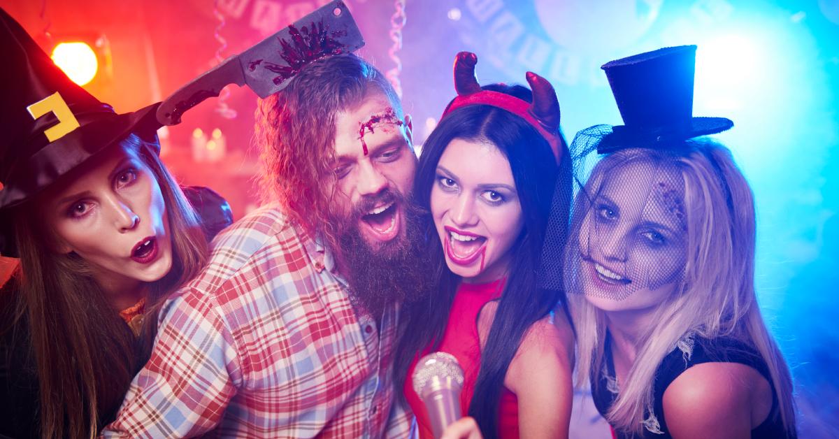 Four friends celebrate Halloween together at a costume party.