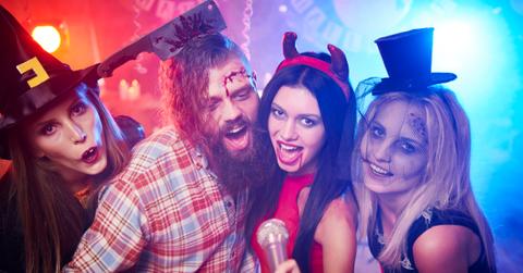 Four friends celebrate Halloween together at a costume party.