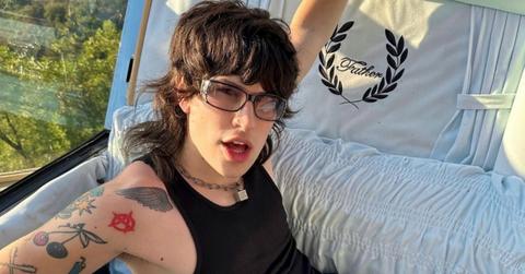 Jake Webber sitting in a coffin