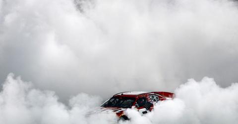 Action shot of Dale Earnhardt Jr. driver of the #8 Budweiser Chevrolet celebrates with a victory burnout