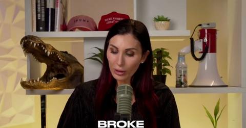 Laura Loomer on her podcast talking into a microphone.