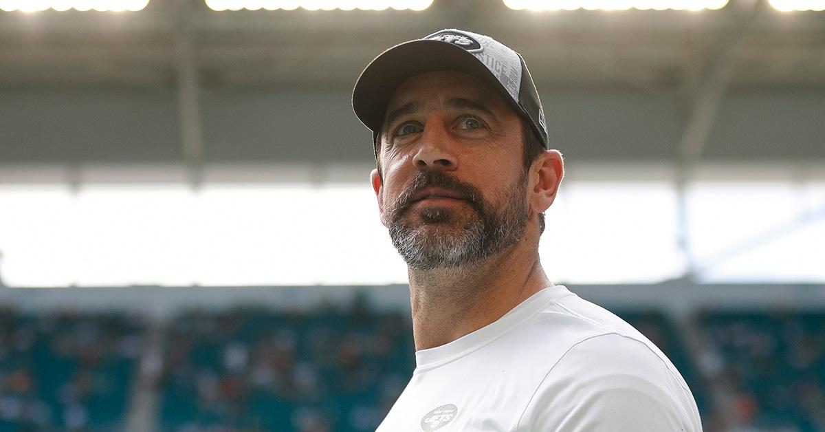 Aaron Rodgers in a Jets hat before a game in Miami. 