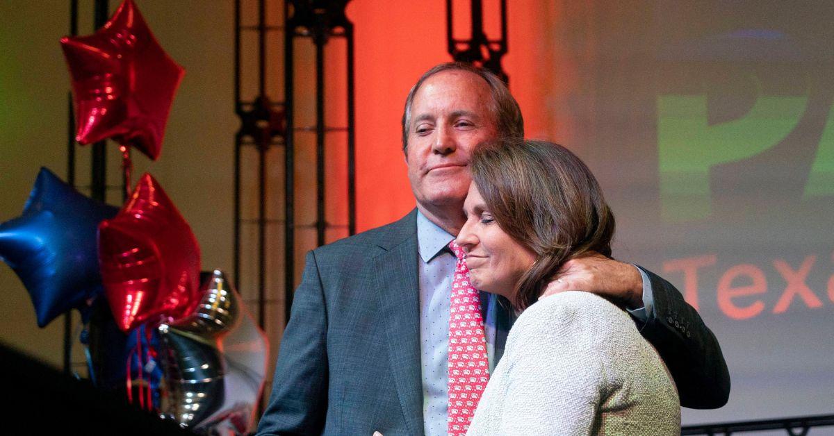 Ken and Angela Paxton embracing on stage at an election event in May of 2022. 