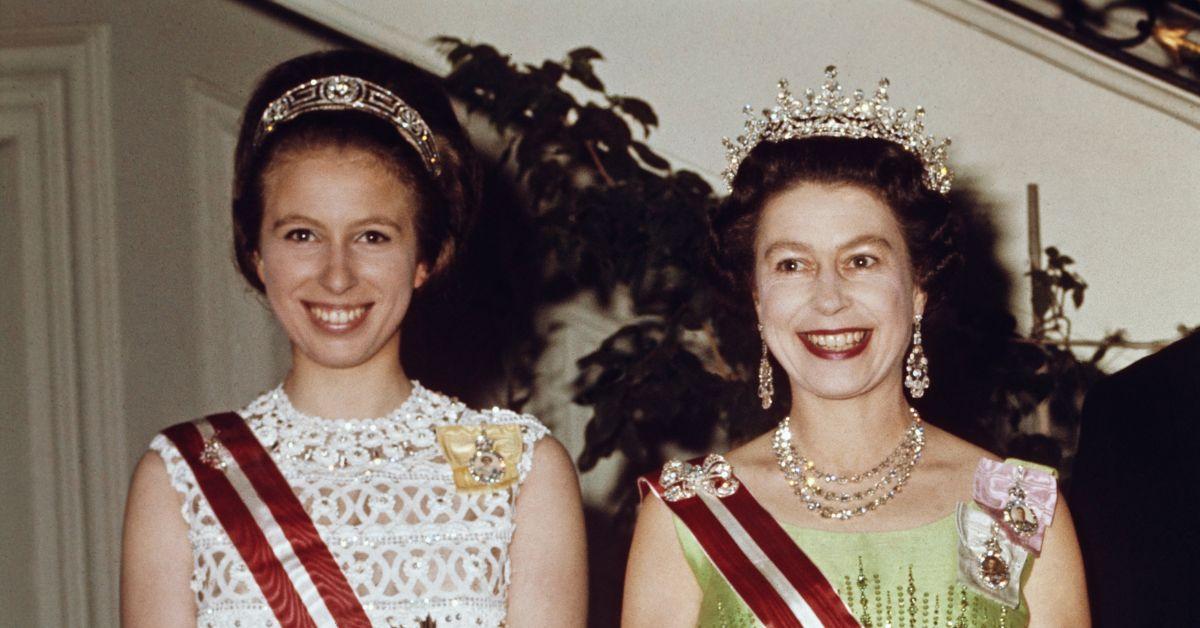 (l-r): Princess Anne and Queen Elizabeth II smiling next to each other.