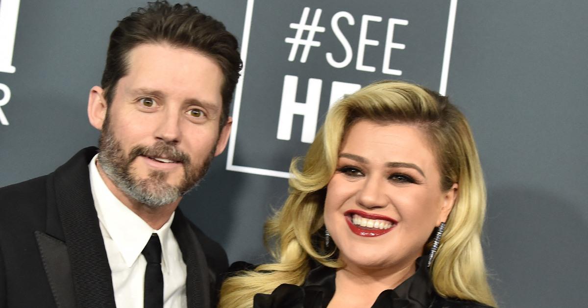 Brandon Blackstock and Kelly Clarkson on a red carpet.