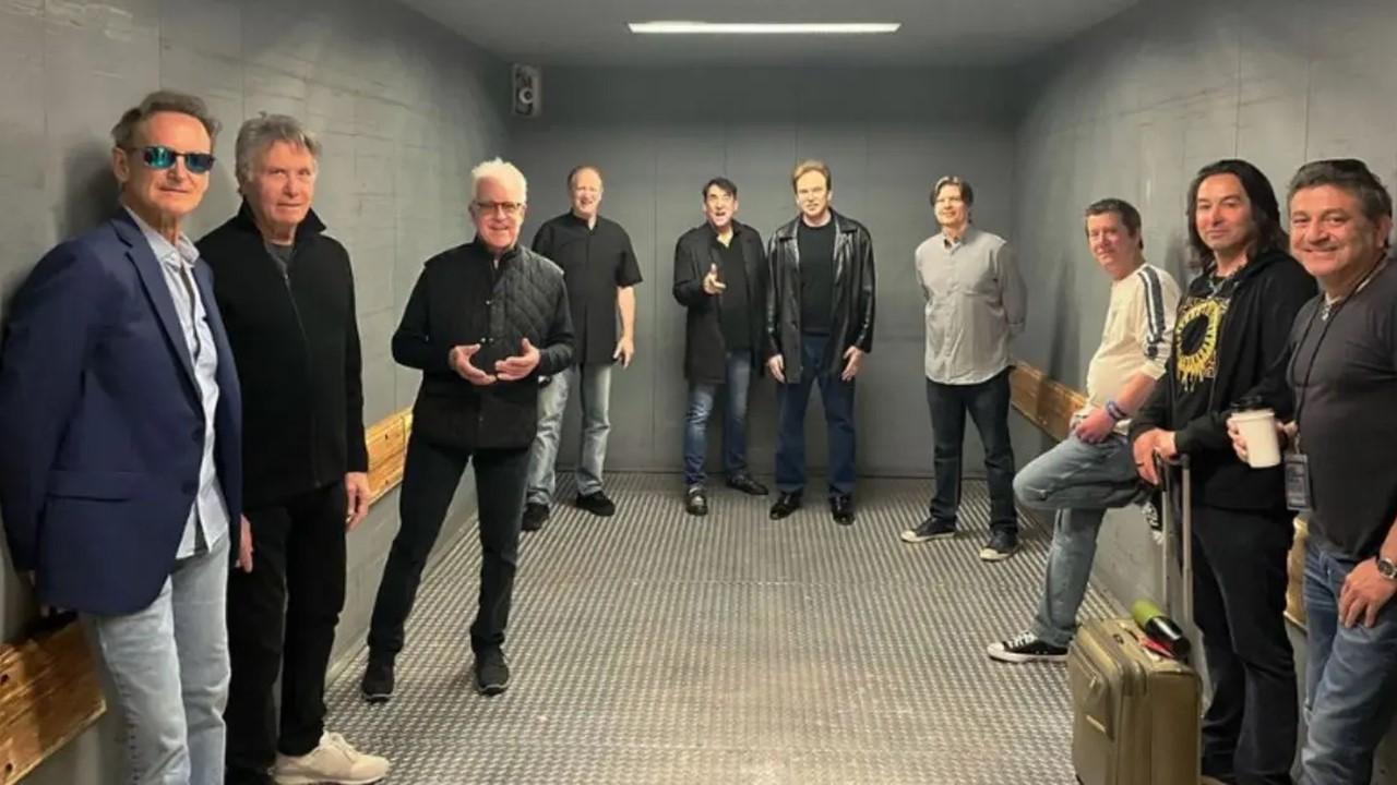 Chicago band poses together in barren room