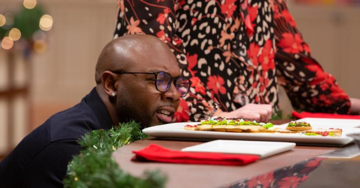 Eddie Jackson inspecting a cookie on 'Christmas Cookie Challenge'