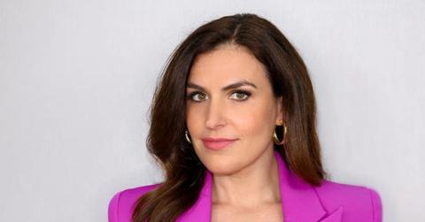 Erin Como wearing a pink blazer