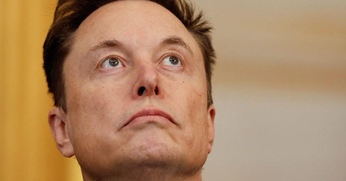 Elon Musk looking up at the ceiling