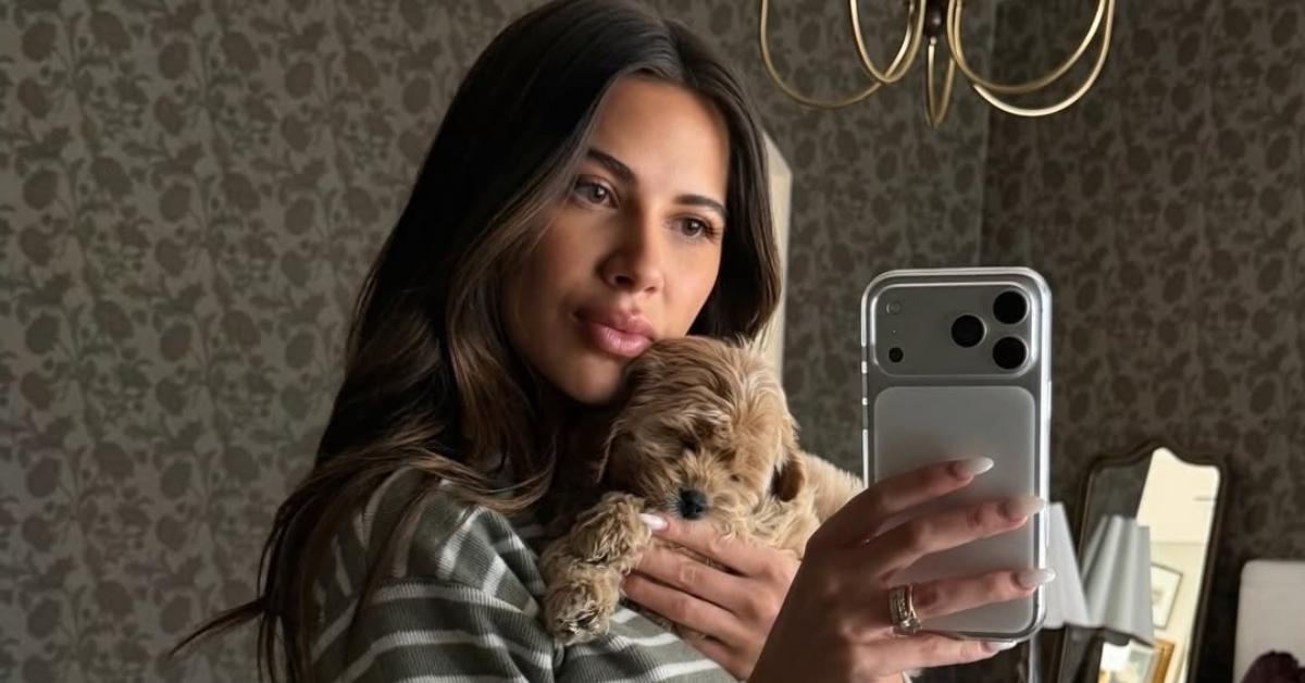 Demi with her dog in a mirror selfie.