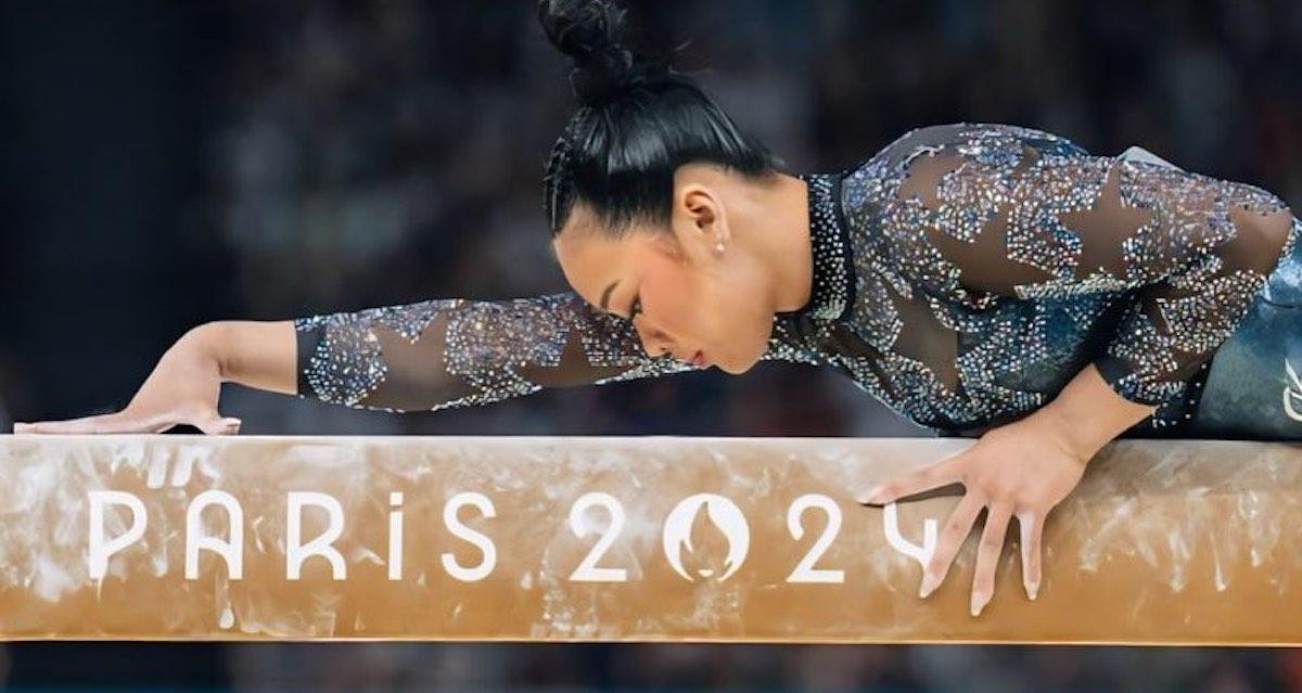 Sunisa Lee poses lying down on Paris 2024 beam