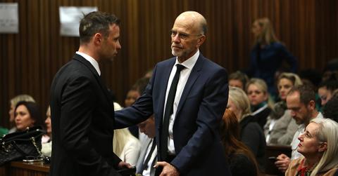 Oscar and Arnold Pistorius at Oscar's trial.