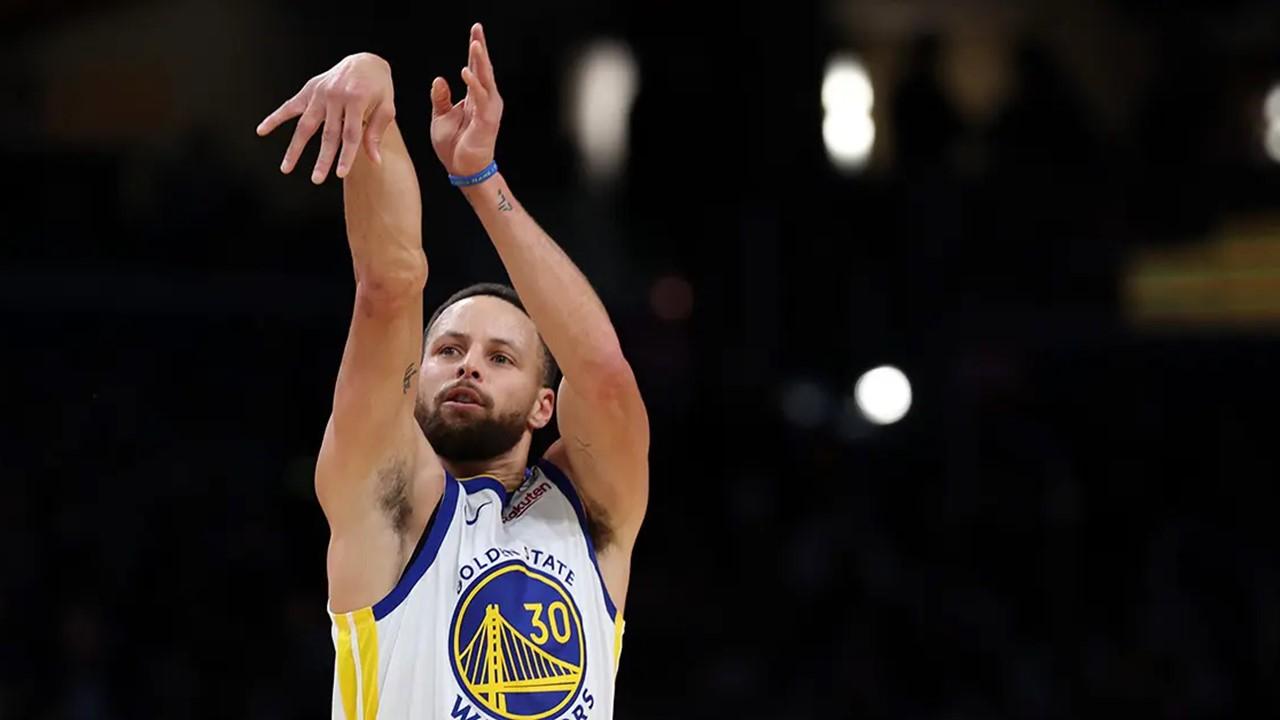 Steph Curry following through on his shot during a game against the Washington Wizards. 